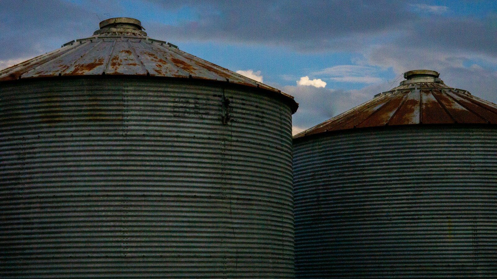 a couple of large metal tanks sitting next to each other
